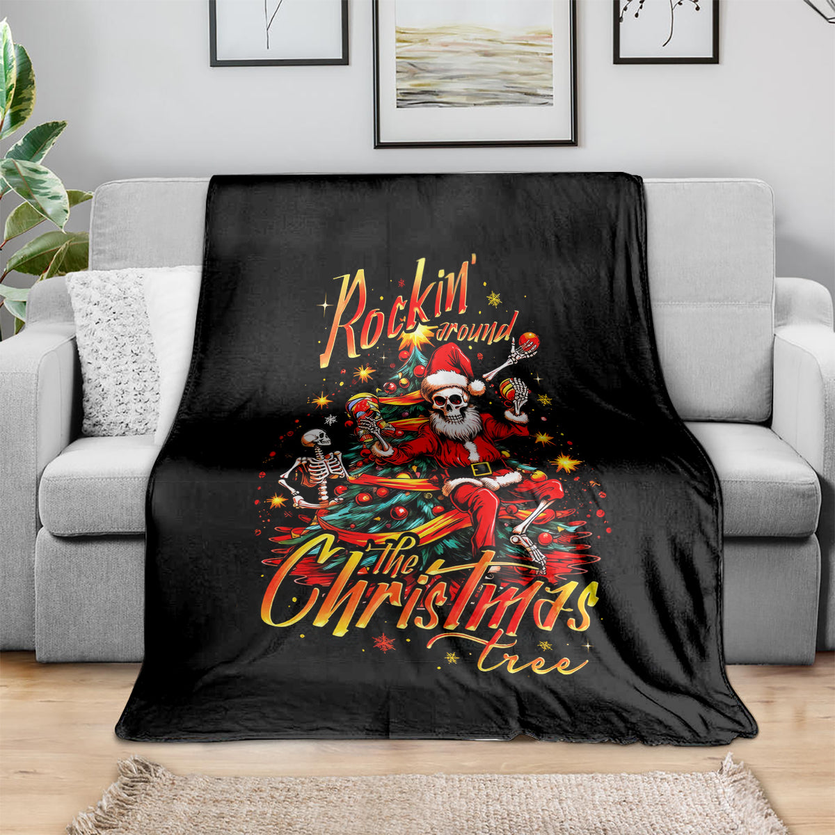 Black throw blanket draped over a sofa, skeleton Santa 'Rockin' Around' design.
