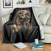Black skeleton Santa blanket over couch arm, snarling skull and clawed hands