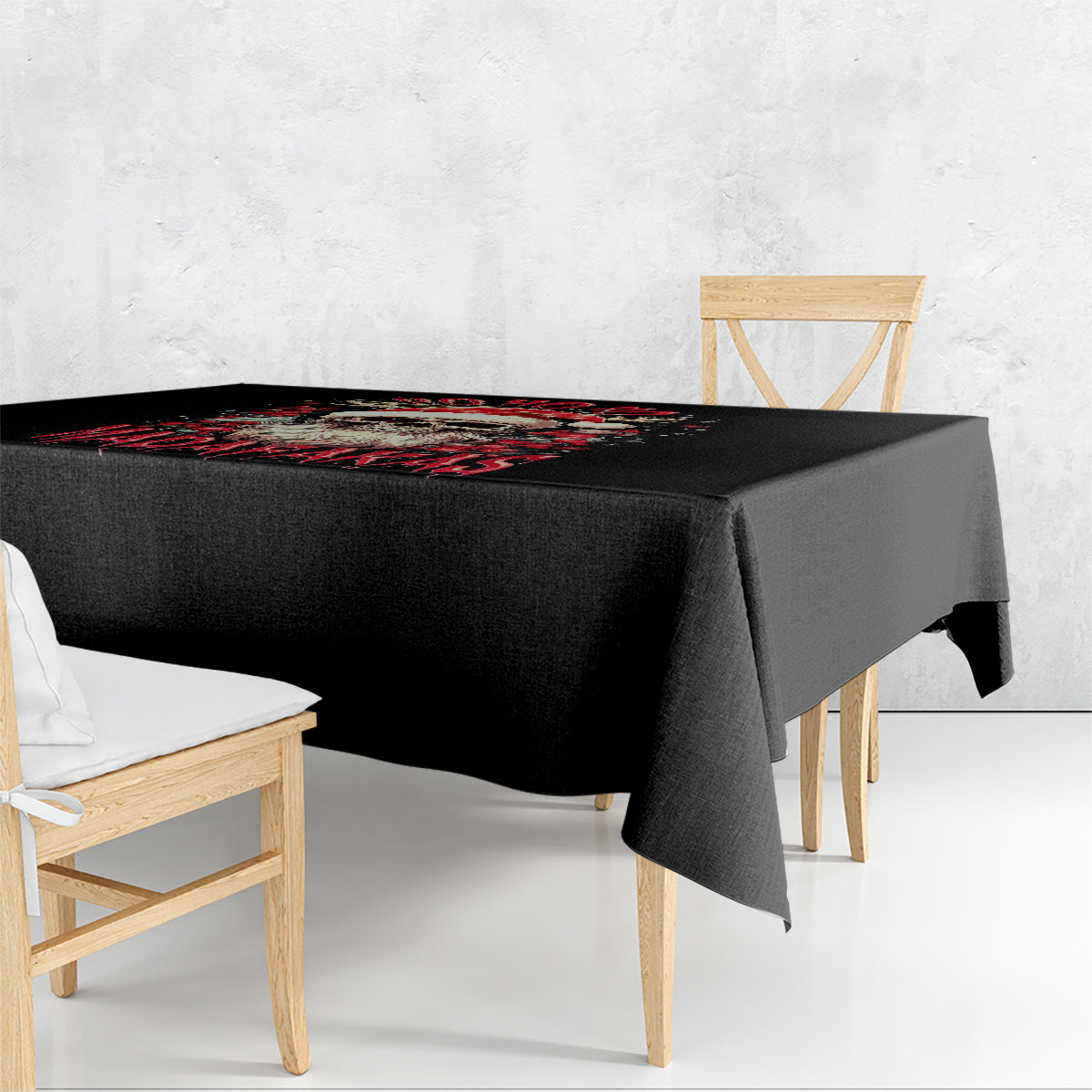 Black printed tablecloth draped over dining table with corner overhang