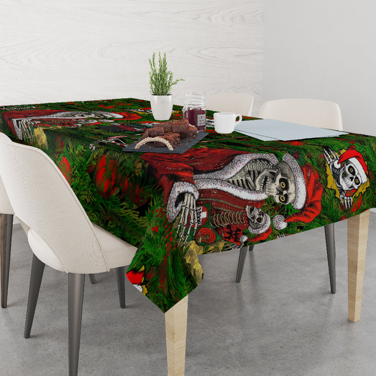 Green tablecloth with skeleton Santa artwork and candy-cane accents across the tabletop