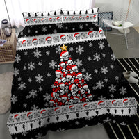 Black duvet set with centered red-and-white skull Christmas tree and scattered snowflakes