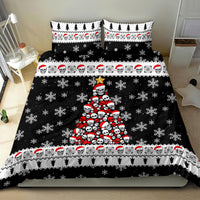 Black Christmas bedding set with skull tree graphic, snowflakes, and repeating Santa-head strip
