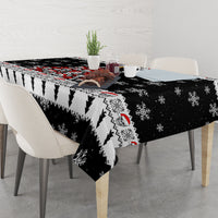 Black Christmas tablecloth on dining table with skull face and snowflake motifs