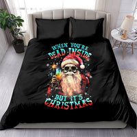 Black bedding set with skull Santa Christmas text graphic on duvet and matching pillows
