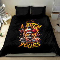 Black bedding set on bed with skull, roses, and hand artwork on duvet and pillows