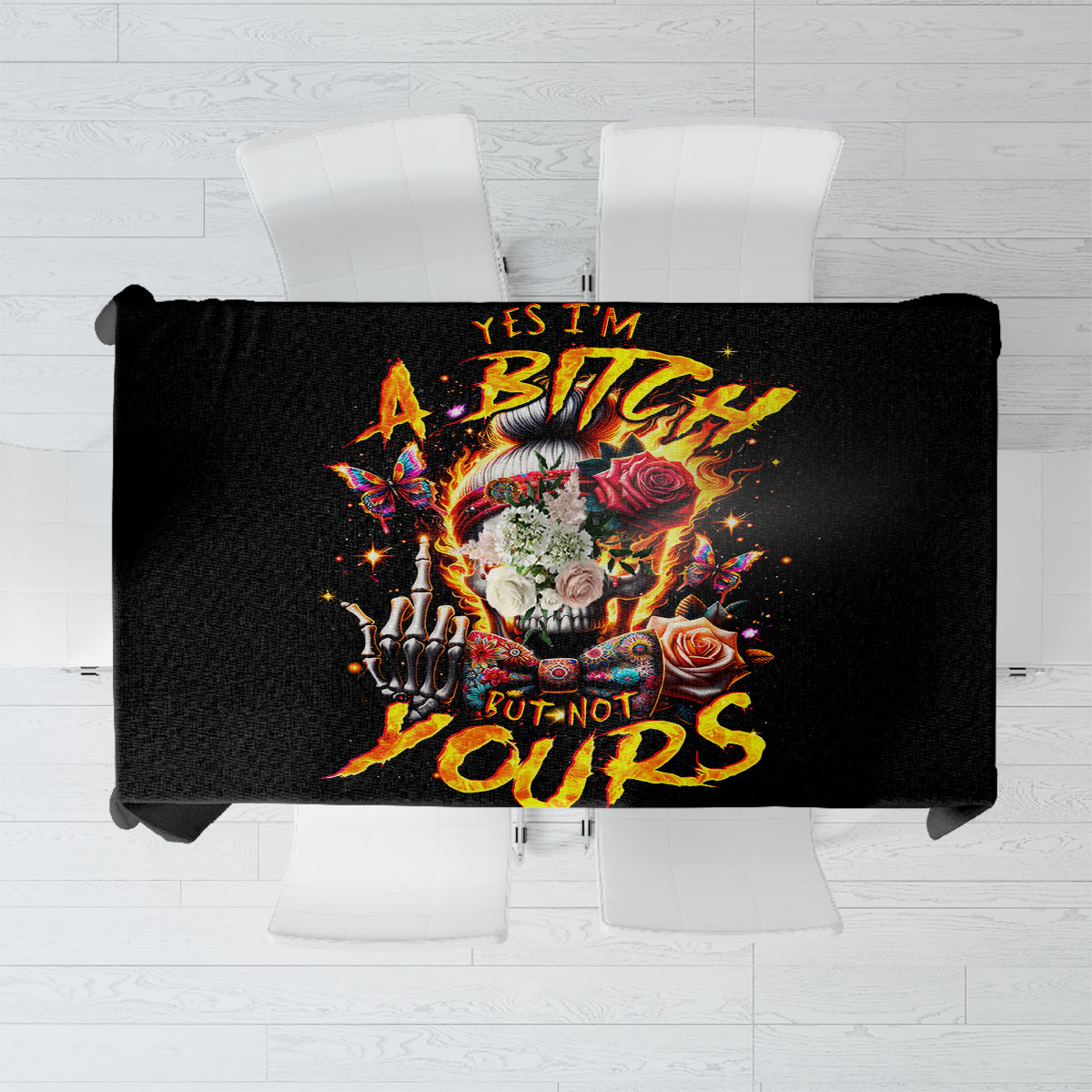 Black tablecloth with colorful skull artwork and flame-style lettering