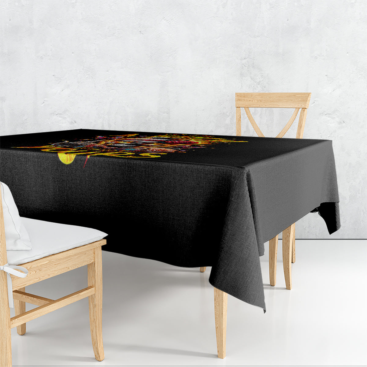 Black tablecloth draped over a dining table with colorful skull print