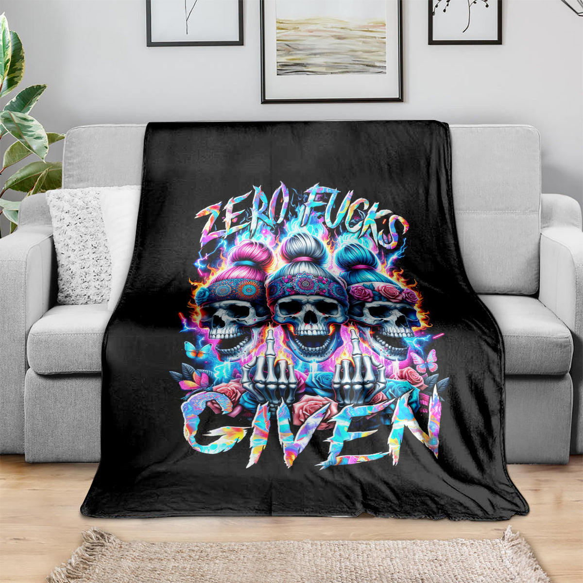 Black sofa throw blanket featuring colorful triple skull and graffiti style text