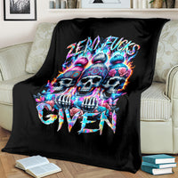 Black blanket with vibrant colorful skulls and graffiti lettering, shown on couch
