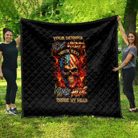 Black diamond-quilted blanket with fiery skull graphic and text design