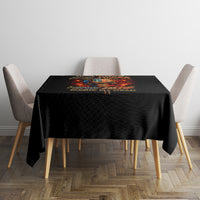 Black tablecloth with fire-skull top graphic on dining table