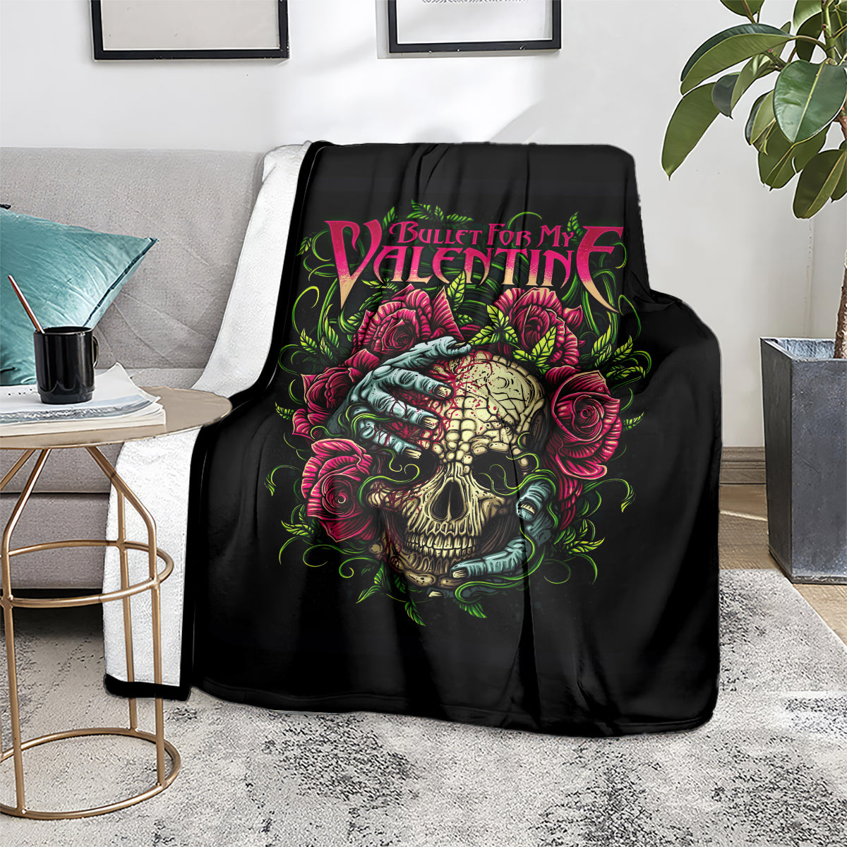 Black skull and roses blanket on a gray couch with colorful “Bullet For My Valentine” text