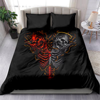 Twin black skull bedding set with devil and angel skeleton graphic, shown on bed