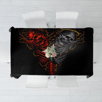 Black skull-themed tablecloth with devil and angel skeleton graphic, rectangular print.