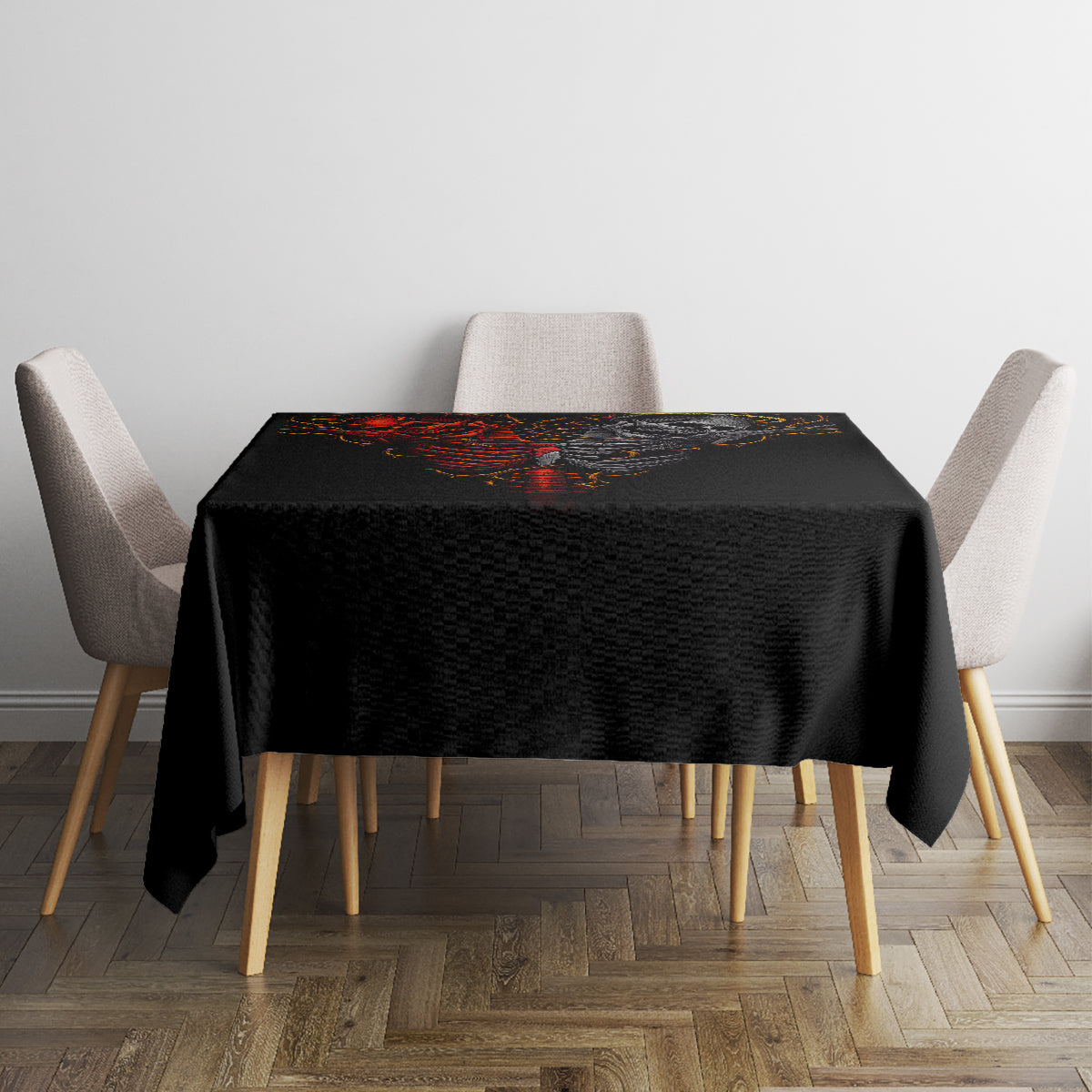 Black skull tablecloth on a square dining table, centered flaming skeleton skull artwork.