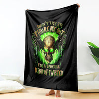 Black skull graphic blanket draped display with neon green glowing face and lettering