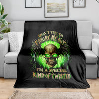 Black skull graphic throw blanket with neon green text and glowing skull design