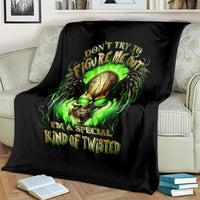 Black skull throw blanket featuring neon green glowing skull and winged text