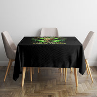 Black skull graphic tablecloth on square dining table with green center print.