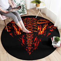 Flame-skull round rug in black with red and orange fire design