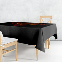 Black tablecloth with red-orange flame pattern along the tabletop edge