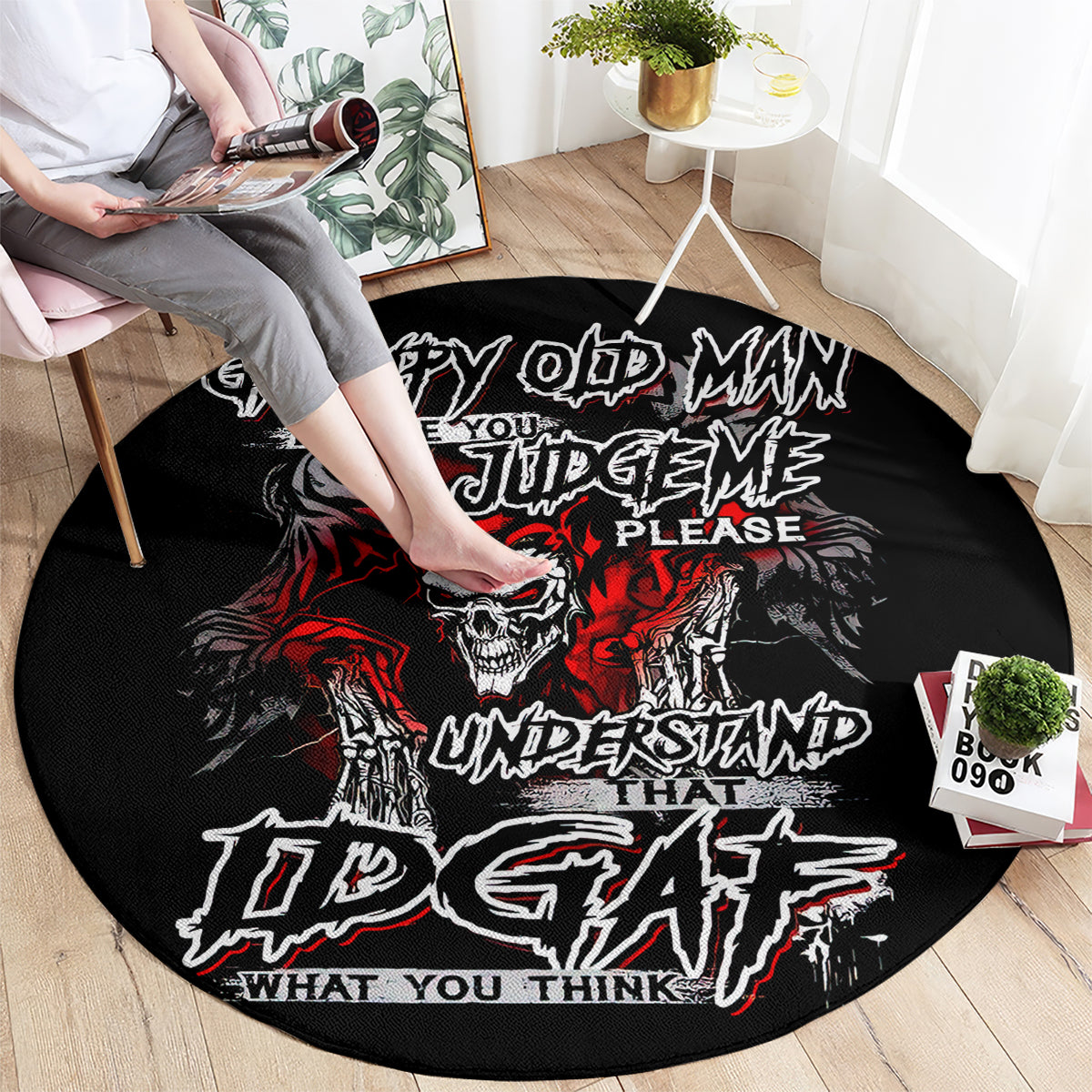 Black round rug with skull graphic and red/white lettering used as a floor mat