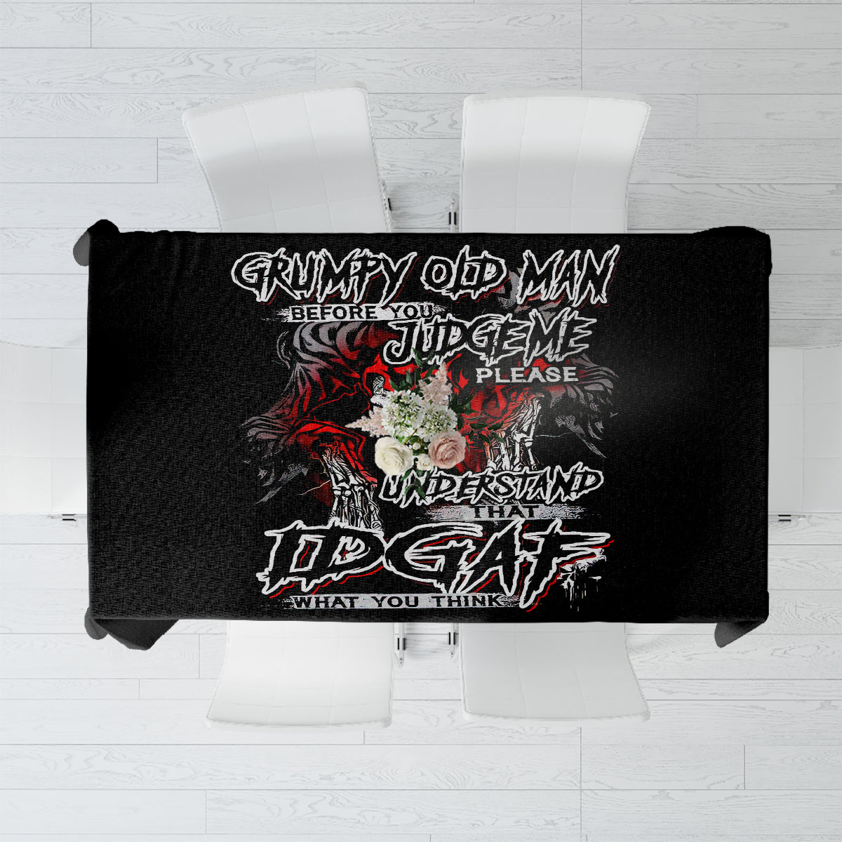 Black skull graphic tablecloth with bold text design, laid flat