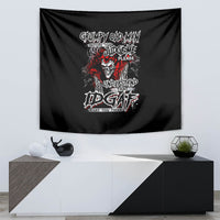 Black wall tapestry with centered skull face and graffiti slogan graphic