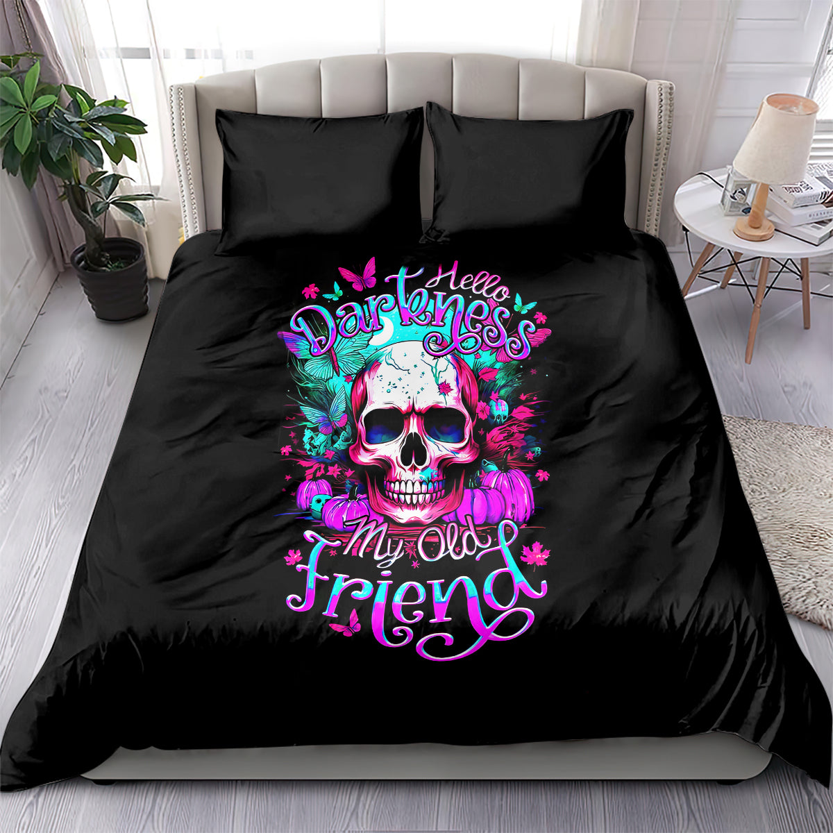 Black bedding set with colorful skull graphic and pink teal lettering on duvet