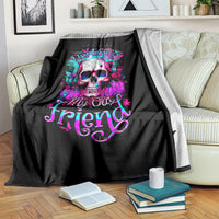 Black skull graphic blanket draped on sofa with colorful “Hello Darkness My Old Friend” text