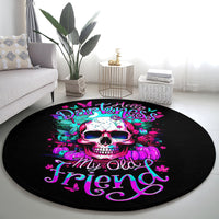Black round area rug with neon skull motif and stylized script text