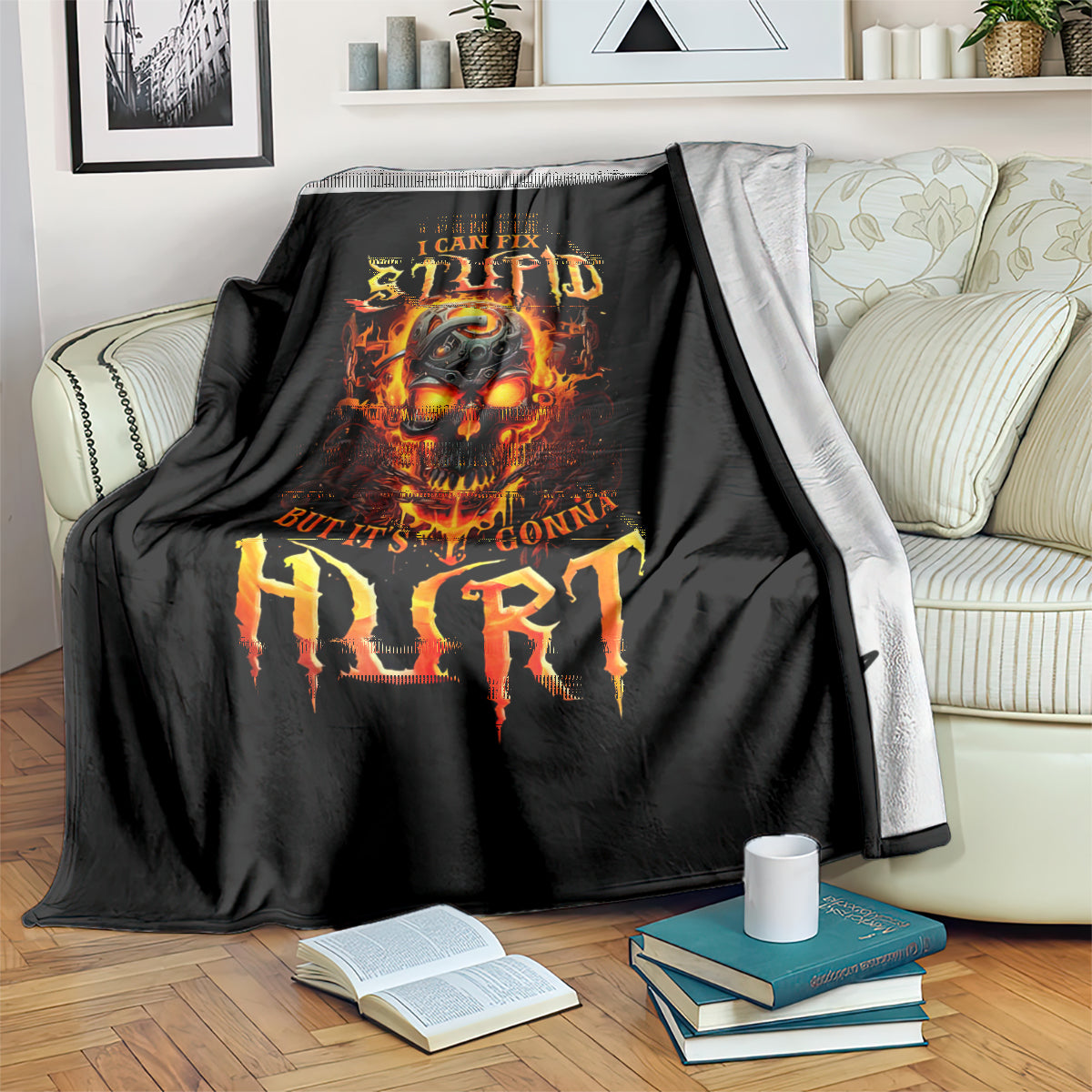 Black flame skull blanket draped over couch arm, with orange fiery text design.