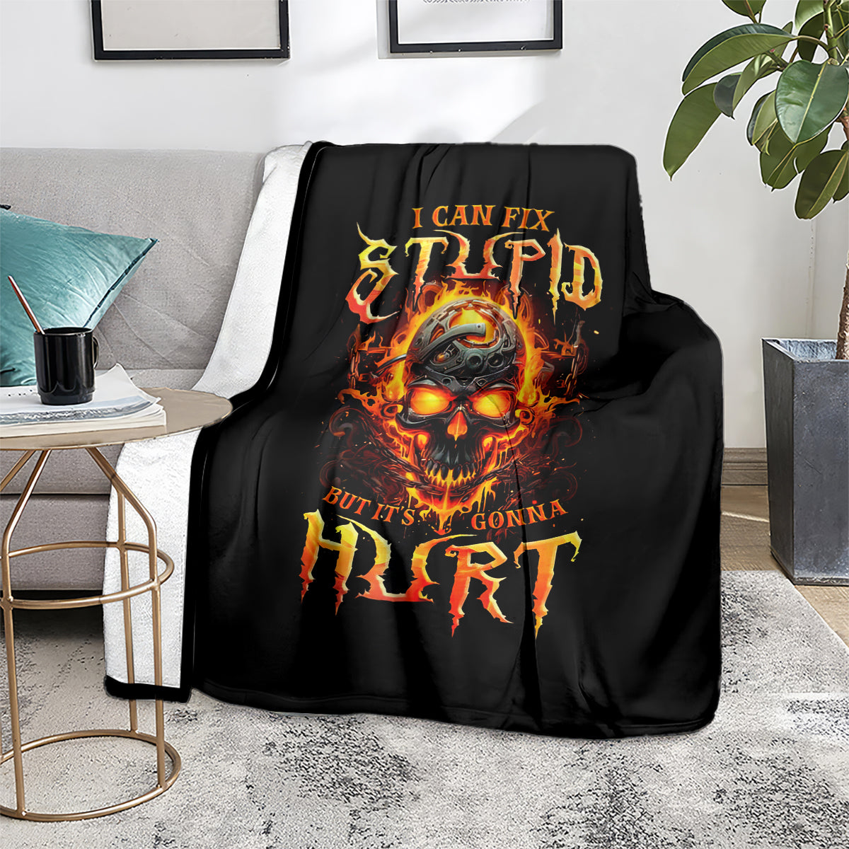 Black blanket with flame skull graphic, orange-yellow lettering, and distressed style.