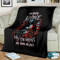 Black skull demon graphic blanket spread on cream striped couch