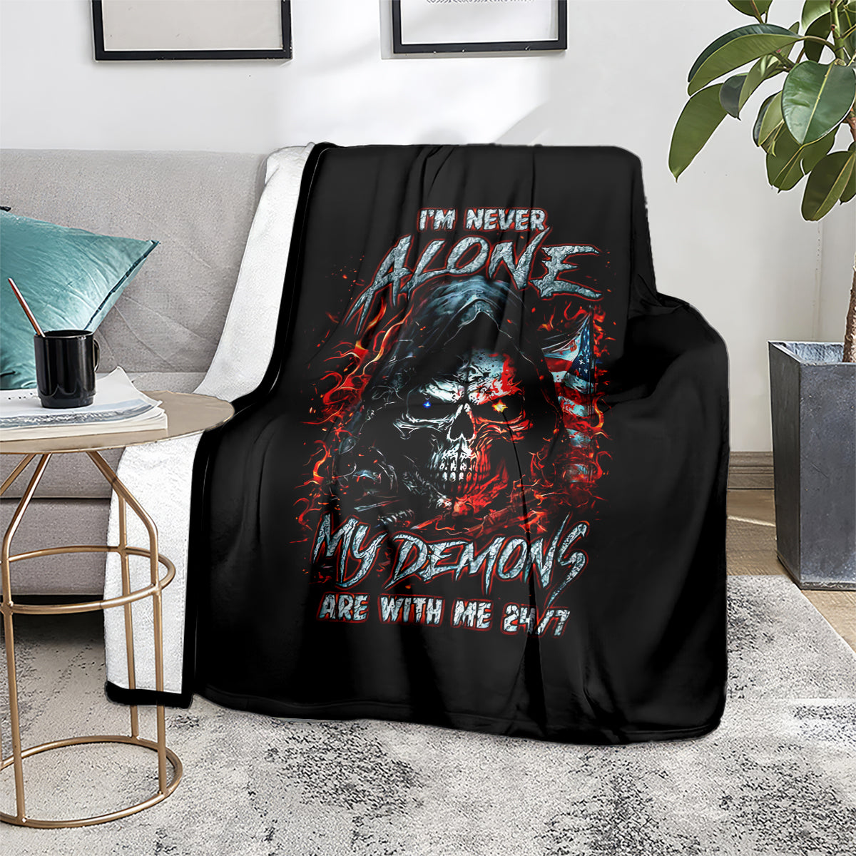 Black skull demon graphic blanket on gray couch with side table
