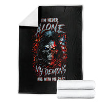 Black skull demon graphic blanket folded with two white rolled fabrics