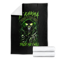 Folded black skull graphic blanket with neon green glowing eyes and text