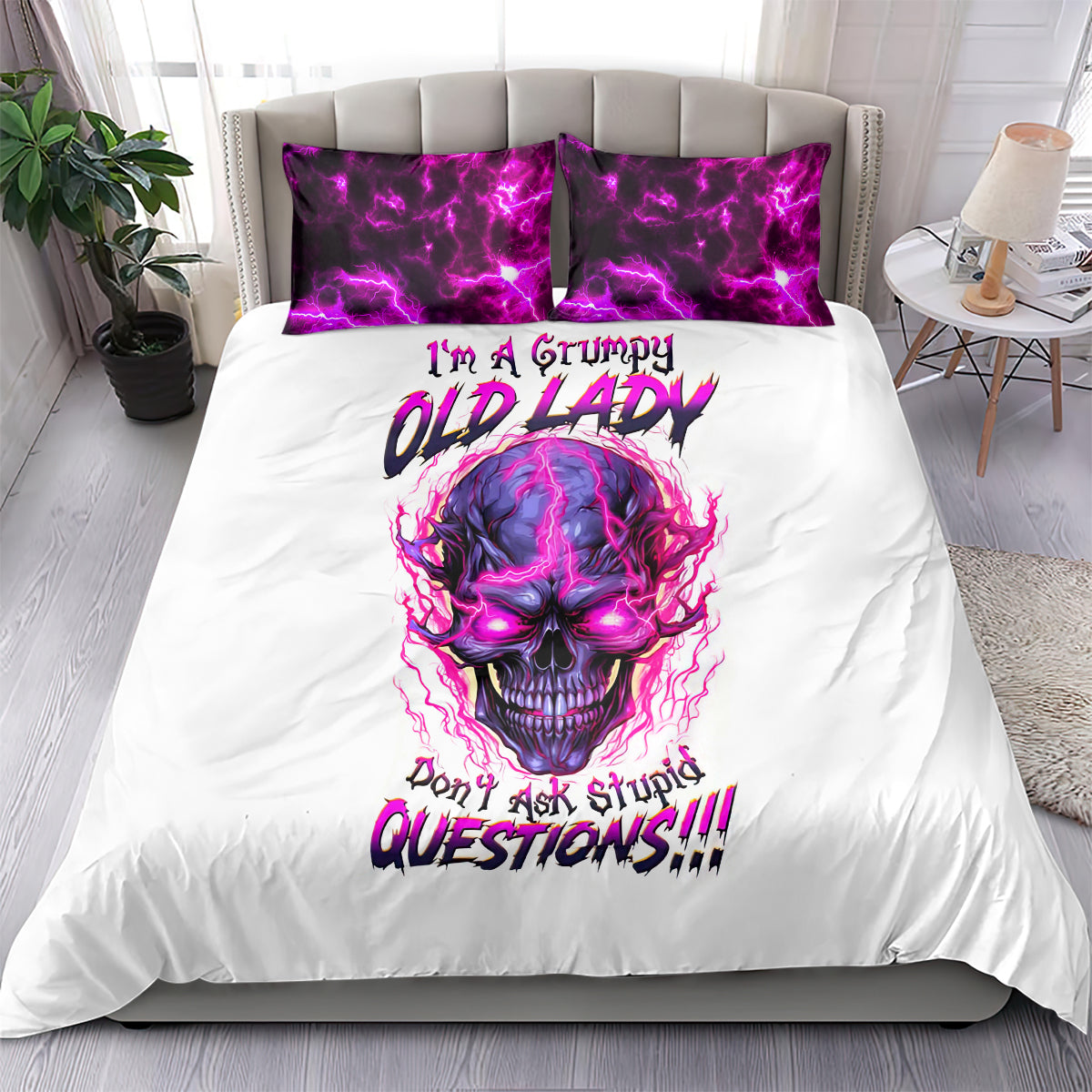 White bedding set with purple skull print and two matching purple pillowcases