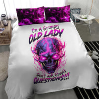 White duvet cover with purple flaming skull graphic and two matching purple pillowcases