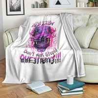 White skull graphic blanket with purple-pink roaring skull and stacked quote lettering