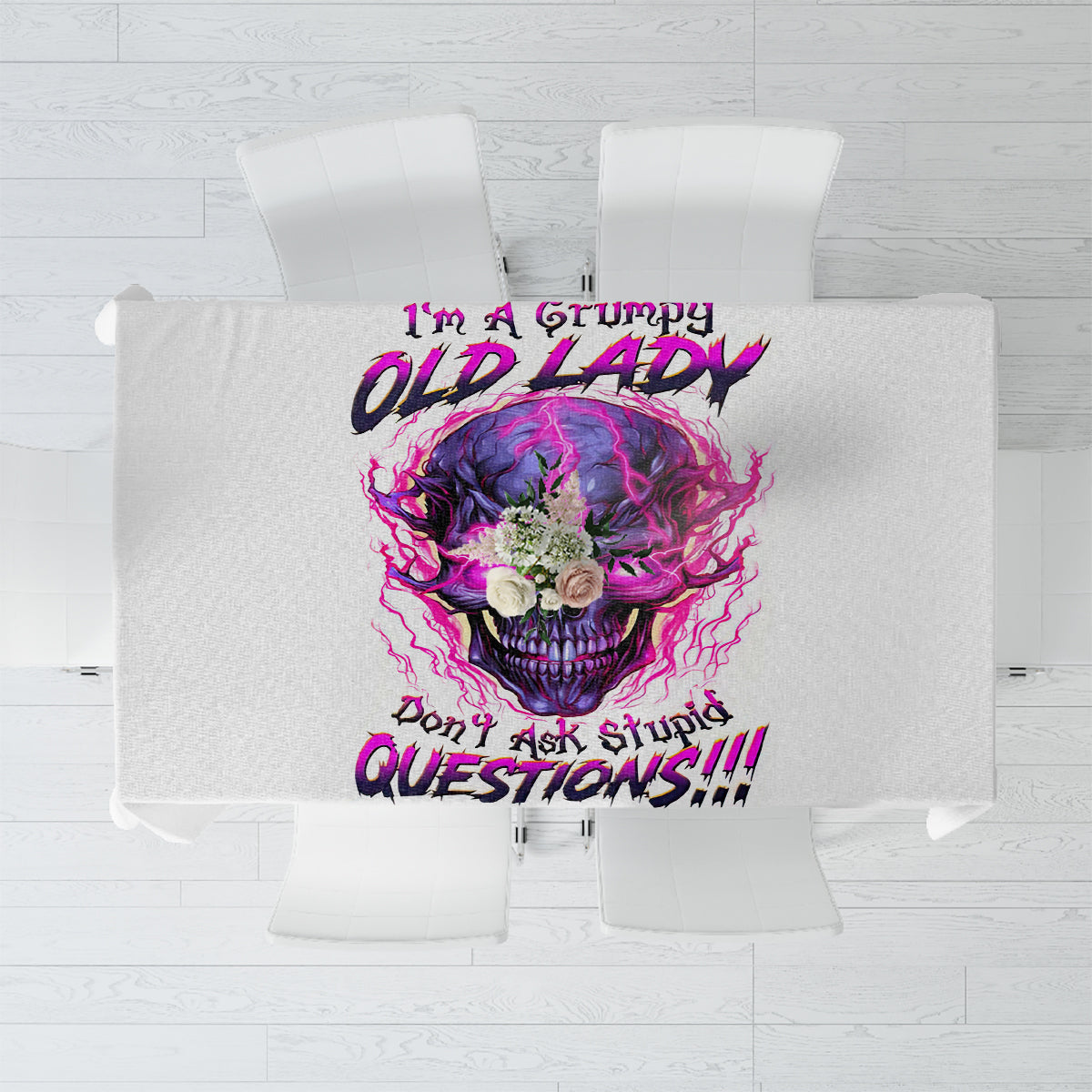 Gray tablecloth with centered purple skull graphic and bold slogan design