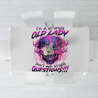 Gray tablecloth with centered purple skull graphic and bold slogan design