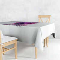 Gray tablecloth with purple skull-themed graphic and jagged fringe edge