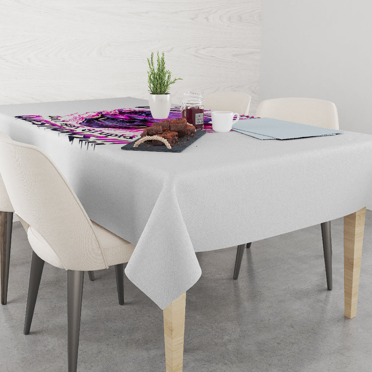 Gray tablecloth with purple skull graphic running along the center, draped corners