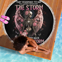 Black round beach blanket with white fringe edge and winged angel skull with pink roses