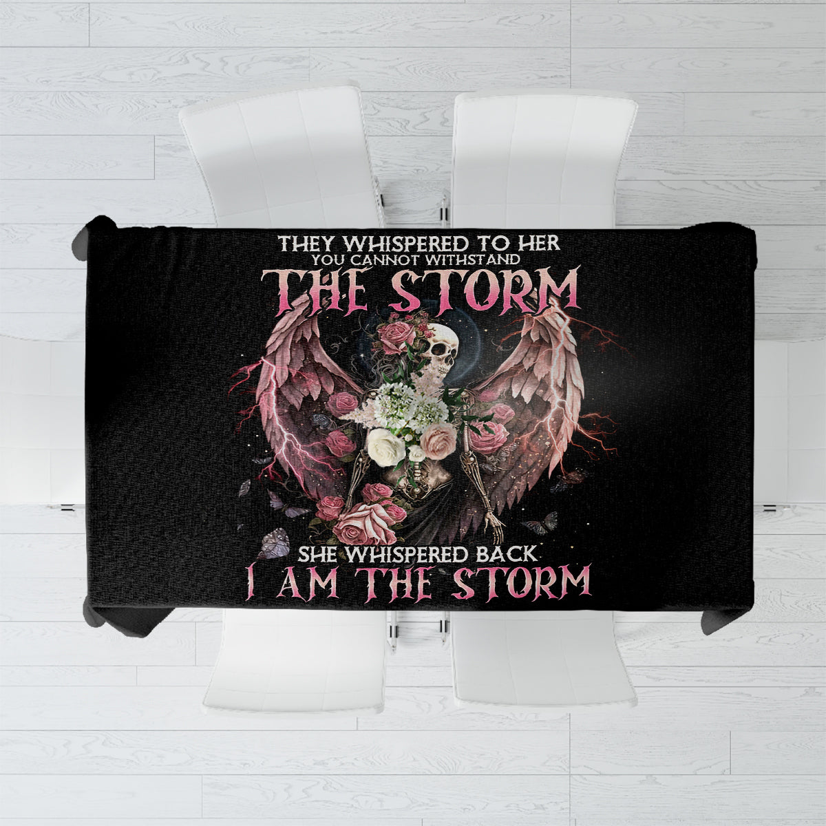 Black tablecloth with skull and rose artwork and gothic lettering across center