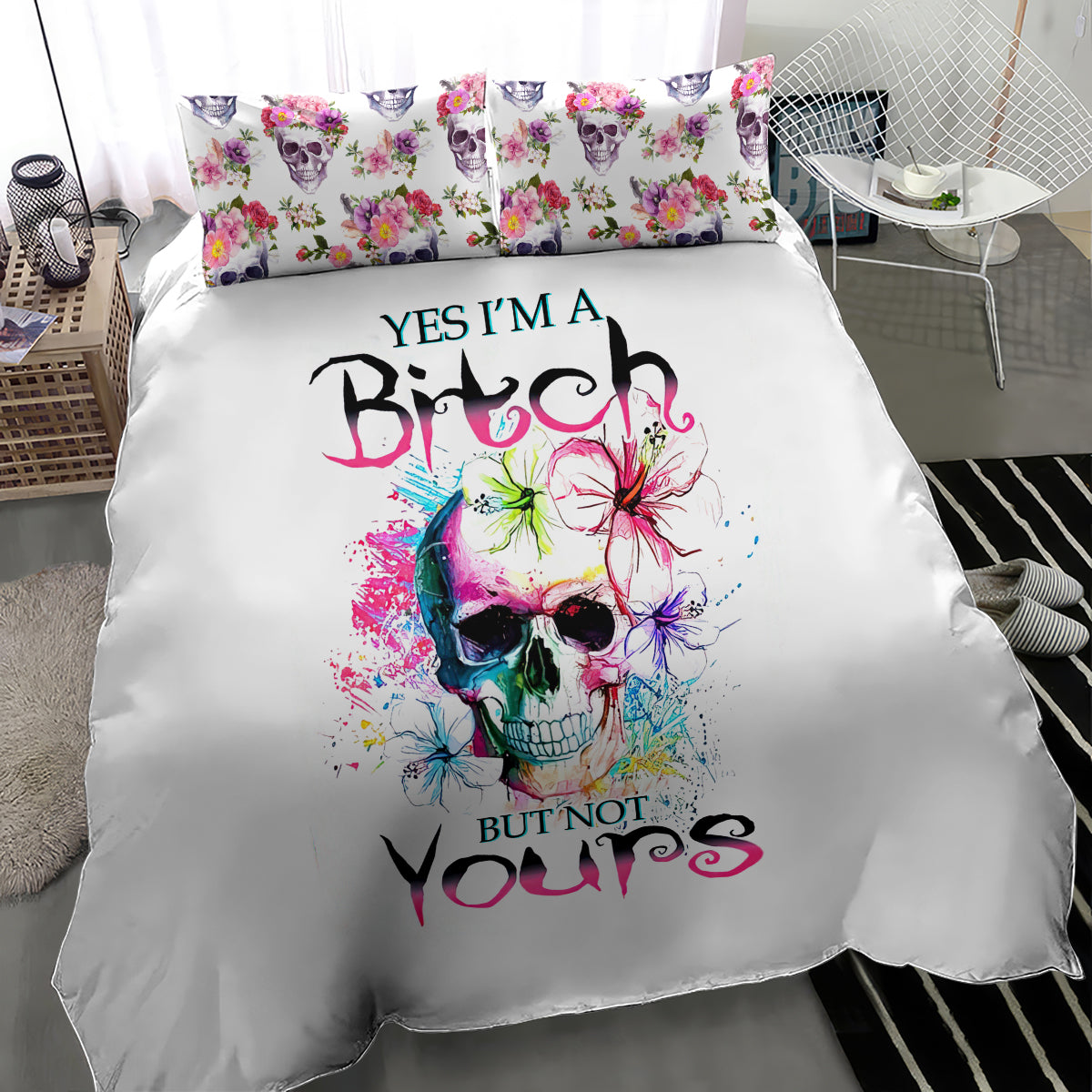 White bedding set featuring large watercolor skull graphic with floral accents on duvet