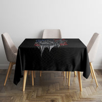 Black tablecloth with skull graphic and red-blue burst design on table