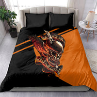 Orange-and-black skull wing duvet with two black pillowcases in a bed setup