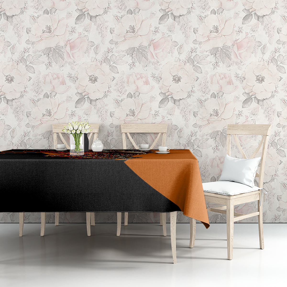 Black and orange skull tablecloth with wing motif on dining table